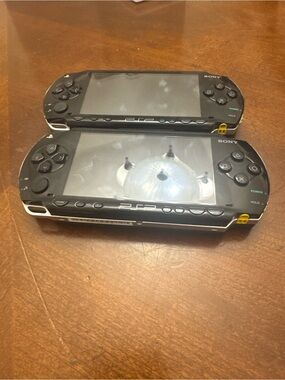 Sony PSP Handheld Gaming Consoles in Black and White Trim